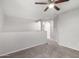 Carpeted hallway with a partial wall featuring an archway leading to another room at 11020 N 154Th Ln, Surprise, AZ 85379