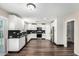 Modern kitchen featuring white cabinets, granite countertops and stainless appliances at 11020 N 154Th Ln, Surprise, AZ 85379