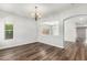 Bright living room with beautiful wood floors and arched doorways at 11020 N 154Th Ln, Surprise, AZ 85379