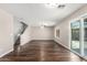 Spacious living room boasts wood floors, stairs and sliding door access at 11020 N 154Th Ln, Surprise, AZ 85379