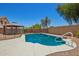 Beautiful backyard pool and gazebo view surrounded by privacy walls and green trees at 11020 N 154Th Ln, Surprise, AZ 85379