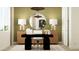 Home office with stylish decor, featuring an accent wall, modern desk setup, and ambient lighting at 11986 W Calle De Pompas --, Peoria, AZ 85383