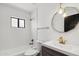 Modern bathroom featuring a bathtub, vanity with stylish mirror and a shower at 12835 N 78Th St, Scottsdale, AZ 85260