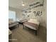 Bedroom with 3 beds, tile floors, and custom graffiti art on the walls at 12835 N 78Th St, Scottsdale, AZ 85260