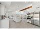 Spacious kitchen with white cabinetry, a large island, stainless steel appliances, and ample counter space at 12835 N 78Th St, Scottsdale, AZ 85260