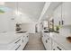 Stylish kitchen with sleek white cabinetry, stainless steel appliances, and a spacious center island at 12835 N 78Th St, Scottsdale, AZ 85260