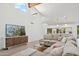 Airy living room featuring vaulted ceilings, a large sectional sofa, and stylish modern decor at 12835 N 78Th St, Scottsdale, AZ 85260