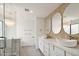 Bright bathroom featuring double sinks, modern fixtures, a glass-enclosed shower, and elegant mirrors at 12835 N 78Th St, Scottsdale, AZ 85260