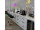 Modern salon area with a coffee bar, multiple styling stations, and chic decor, creating a professional and inviting atmosphere at 12835 N 78Th St, Scottsdale, AZ 85260