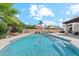 Inviting pool with lounge chairs, sun umbrellas and beautiful landscaping, perfect for relaxation and outdoor enjoyment at 12835 N 78Th St, Scottsdale, AZ 85260