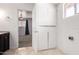 A well-maintained bathroom with neutral tile flooring and a view into a bedroom at 1545 W 7Th Ave, Mesa, AZ 85202