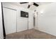 Carpeted bedroom with a ceiling fan and ensuite bathroom access at 1545 W 7Th Ave, Mesa, AZ 85202