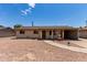 Charming single-story home featuring a gravel yard, quaint fountain, and convenient carport at 1545 W 7Th Ave, Mesa, AZ 85202