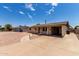Charming single-story home featuring gravel landscaping, a carport, and concrete driveway at 1545 W 7Th Ave, Mesa, AZ 85202