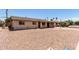 View of a single-story home with gravel landscaping, a charming fountain, and a covered carport at 1545 W 7Th Ave, Mesa, AZ 85202