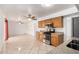 Open kitchen featuring wood cabinetry, granite countertops, and stainless steel appliances at 1545 W 7Th Ave, Mesa, AZ 85202
