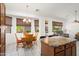 Bright dining area with multiple windows offering backyard views and a chandelier at 17653 W Ingleside Dr, Surprise, AZ 85374