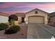 Inviting single-story home with a two-car garage, well-manicured yard, and classic design at 17653 W Ingleside Dr, Surprise, AZ 85374