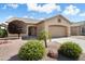 Charming single-story home featuring a two-car garage, neutral paint, desert landscaping and a lovely, sunny curb appeal at 17653 W Ingleside Dr, Surprise, AZ 85374