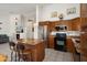 Open kitchen featuring stainless steel appliances, granite countertops, and a breakfast bar at 17653 W Ingleside Dr, Surprise, AZ 85374