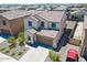 Two-story tan house featuring desert landscaping, a tile roof, and a red pick-up truck in the driveway at 19889 W Annika Dr, Litchfield Park, AZ 85340