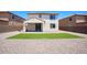 Well-maintained backyard with artificial turf and desert landscaping, perfect for low-maintenance living at 19889 W Annika Dr, Litchfield Park, AZ 85340