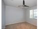 Bright bedroom with a ceiling fan and a window, offering a blank canvas for personalization at 19889 W Annika Dr, Litchfield Park, AZ 85340
