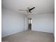Spacious bedroom featuring a ceiling fan and neutral carpet, offering a blank canvas for personalization at 19889 W Annika Dr, Litchfield Park, AZ 85340