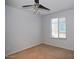 Bright bedroom featuring a ceiling fan and a window, offering a blank canvas for personalization at 19889 W Annika Dr, Litchfield Park, AZ 85340