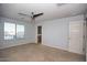 Bedroom featuring carpet, window and neutral paint at 19889 W Annika Dr, Litchfield Park, AZ 85340