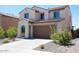A delightful home with a stucco finish, tile roof, well-maintained landscaping, and two car garage at 19889 W Annika Dr, Litchfield Park, AZ 85340