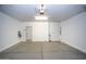 Clean, spacious garage with ample room for storage and parking at 19889 W Annika Dr, Litchfield Park, AZ 85340