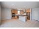 Bright, open kitchen features stainless steel appliances, a center island and tile flooring at 19889 W Annika Dr, Litchfield Park, AZ 85340