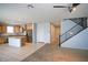 Open-concept kitchen with granite countertops, stainless steel appliances and tiled floor at 19889 W Annika Dr, Litchfield Park, AZ 85340