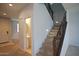 Carpeted staircase with decorative wrought iron banister and neutral paint at 19889 W Annika Dr, Litchfield Park, AZ 85340