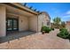 Enclosed patio area featuring brick pavers and lush landscaping at 21017 W Edith Way, Buckeye, AZ 85396