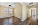 Spacious bedroom featuring wood-look floors and natural light from multiple windows at 21017 W Edith Way, Buckeye, AZ 85396