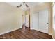 Cozy bedroom featuring wood floors and a spacious closet with sliding doors at 21017 W Edith Way, Buckeye, AZ 85396