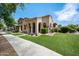 Lovely single-story home with well-kept lawn and attractive desert landscaping on a sunny day at 21017 W Edith Way, Buckeye, AZ 85396