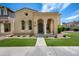Charming single-story home with stucco facade, landscaped front yard, and welcoming arched entryway at 21017 W Edith Way, Buckeye, AZ 85396