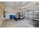 Spacious garage featuring a golf cart and ample storage shelves at 21017 W Edith Way, Buckeye, AZ 85396