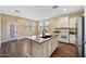 Bright kitchen featuring a center island with sink, modern appliances, and ample counter space for cooking at 21017 W Edith Way, Buckeye, AZ 85396