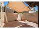 A spacious patio with a brick floor, brick fence, and partial shade at 2107 W Lane Ave, Phoenix, AZ 85021