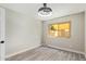 This bedroom features hardwood floors, a modern ceiling fan, and natural light from a window at 2107 W Lane Ave, Phoenix, AZ 85021
