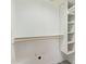 A bright, freshly painted closet with shelves and a clothing rod at 2107 W Lane Ave, Phoenix, AZ 85021