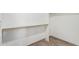 Walk-in closet with wire shelving for organized storage, light walls, and wood-look floors at 2107 W Lane Ave, Phoenix, AZ 85021