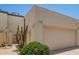 Cozy home featuring a two-car garage, desert landscaping, and a private gated entry at 2107 W Lane Ave, Phoenix, AZ 85021