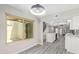 Eat-in kitchen boasts white cabinets, modern appliances, wood-look floors, and breakfast bar area at 2107 W Lane Ave, Phoenix, AZ 85021