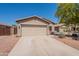Charming single-story home with a two-car garage and well-maintained landscaping at 21311 N Shelby Ct, Maricopa, AZ 85138