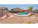 Inviting backyard pool with covered patio, perfect for relaxing or entertaining at 21311 N Shelby Ct, Maricopa, AZ 85138